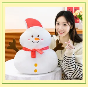 Detailed shot of a cute snowman plush pillow with red hat and scarf, cozy indoor toy display.