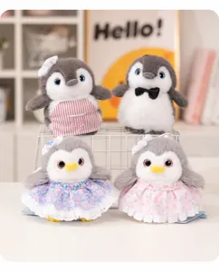 Cute plush penguin doll toy with apron and dress, perfect desktop decoration companion.