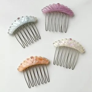 Four assorted acetate hair combs featuring sparkly rhinestone crystals for elegant updos.
