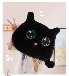 Cute black cat plush pillow detail view, soft plush fabric featuring adorable embroidered big eyes.