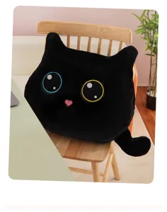 Cute black cat plush pillow, soft toy cushion for sofa and home decoration details.
