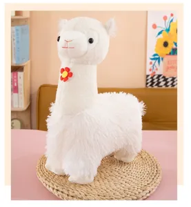 Cute white alpaca plush toy with lovely flower, soft stuffed animal doll for home decor.