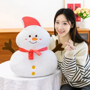Cute Christmas snowman plush pillow with red hat and scarf, soft stuffed toy for holiday gift.