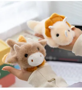 Cute floral lying animal plush toy, dinosaur and cow doll detail, soft desktop companion.
