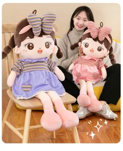 Cute plush doll toy detail showcasing soft fabric, sweet purple dress and bow design.