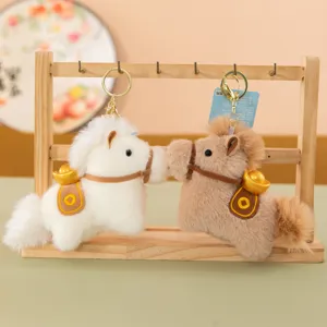 Cute plush horse keychain with gold ingot bag pendant, soft stuffed animal mascot gift for new year.