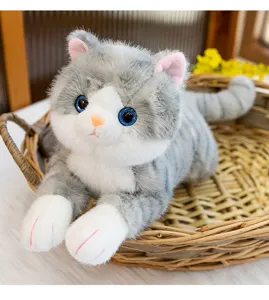 Cute grey cat plush toy close-up, soft lying kitty doll pillow for birthday gifts.