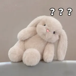 Fluffy beige pink lop-eared rabbit plush toy, cute soft stuffed animal doll for hugging.