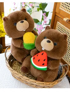 Detail shot of cute marmot plush toys holding corn and watermelon, soft stuffed animal decor.