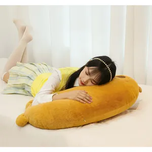 Soft yellow long plush duck body pillow, comfortable cute sleeping bolster for bedroom bed use.