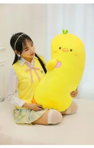 Cute long yellow duck plush toy pillow detail view, soft sleeping cushion for girls bedroom decor.