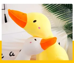 Cute yellow and white duck plush toy pillow, soft stuffed animal companion for kids home decor.