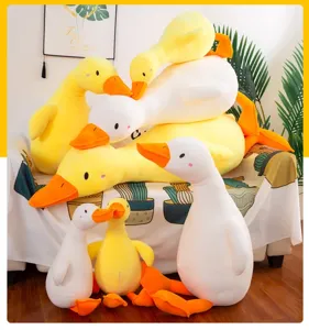 Detailed shot of cute soft duck plush toys in various poses, fluffy pillow cushion for cozy room.
