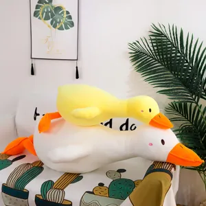 Soft plush yellow duck and white goose pillow toy, cute stuffed animal cushion for kids room.