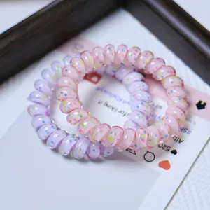 Colorful polka dot phone cord hair ties, transparent spiral hair bands, high elasticity detail.