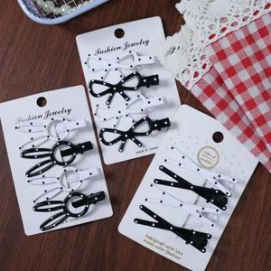 Korean style black and white polka dot bow hair clip set detail view for women daily.