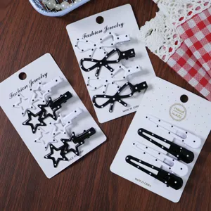 Korean style black and white polka dot hair clips set, cute bow and star side clip details.