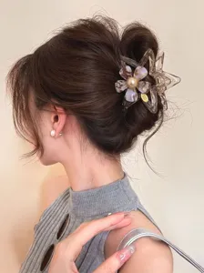 Acetate flower star hair claw clip for women, elegant translucent shark clip for stylish updo.