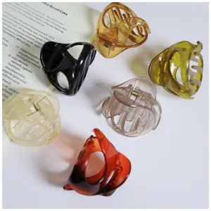 Close-up of colorful translucent hair claw clips with irregular shapes for daily styling.