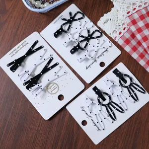 Detailed close-up of cute polka dot hair clips set on display cards with nice background.