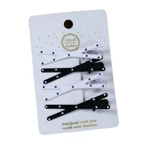 Korean style sweet polka dot cross hair clips for women, cute black and white side accessories.