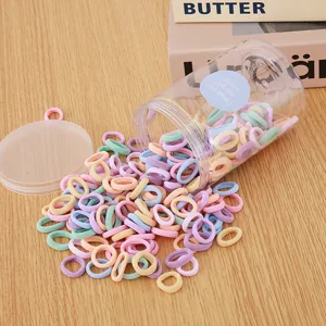 Colorful seamless mini hair elastics for kids, candy color hair ties in clear storage jar.