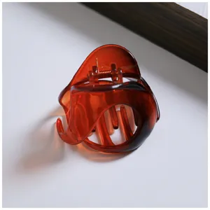 Amber brown translucent hair claw clip stylish irregular design daily hair styling accessory.