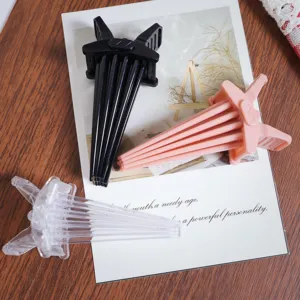 Detailed close-up view of plastic hair root volumizing clips, showing multi-color options clearly.