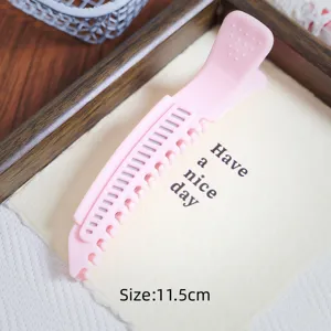 Root volume hair clip pink duckbill clip styling tool detail view for daily use and styling.