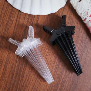Root hair volume clips detail shot, clear and black plastic styling tools for bangs.