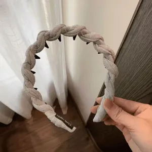 Twisted braided hair hoop with teeth detail, stylish grey headband for women daily wear.