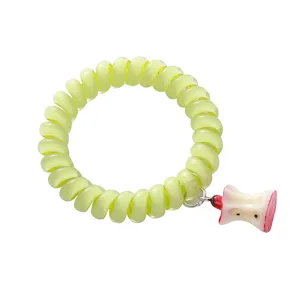 Carino elastico per capelli a spirale verde con ciondolo torsolo di mela carino