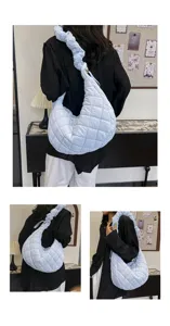 Hellblaue gesteppte Schultertasche für Damen, modische Puffer Hobo Tasche mit schickem Riemen.