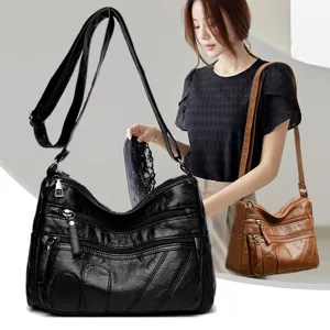 Washed soft leather crossbody bag with multiple pockets and compartments for women. Chic shoulder bag.