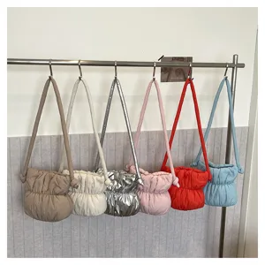 Fashionable pleated puffer shoulder bag, soft nylon casual bucket bag in multiple vibrant colors.