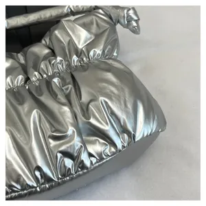 Silver metallic puffer shoulder bag, trendy pleated nylon cloud bag detailed view.