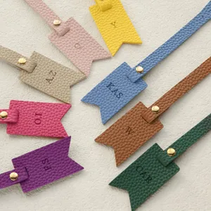 Colorful PU leather initial luggage tags with gold hardware, personalized letter bag charms.