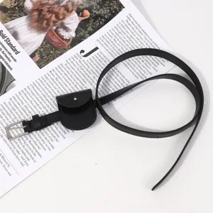 Detail view of black leather belt with mini pouch, minimalist ins style waist accessory.