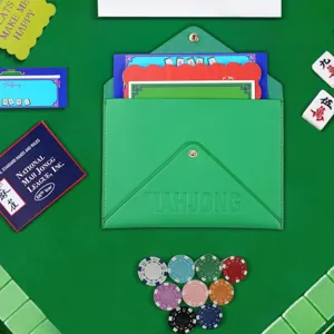 Green faux leather Mahjong card storage bag with snap closure, stylish flat lay main image.