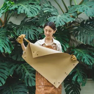 Waterproof thickened leather gardening mat for potted plant repotting and soil changing tray.