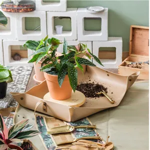 Waterproof leather gardening mat for indoor plants, durable folding potting tarp tray for soil mixing.