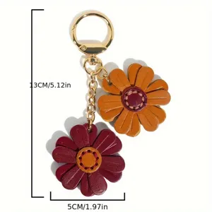 Simpatico portachiavi con margherita in pelle e ciondolo borsa a forma di girasole.