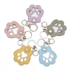 Cute cat paw pet fur memorial keychain with storage photo holder and metal clasp rings.