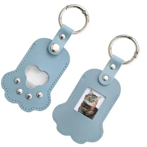 Cute blue paw shape leather keychain for pet photo and hair memorial keepsake pendant.
