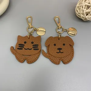 Niedliches Tier Leder Schlüsselanhänger Set mit Katze und Hund, goldener Metallclip für Tasche.