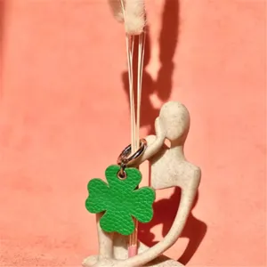 Green leather four leaf clover pet ID tag charm keychain accessory for dogs cats cute.