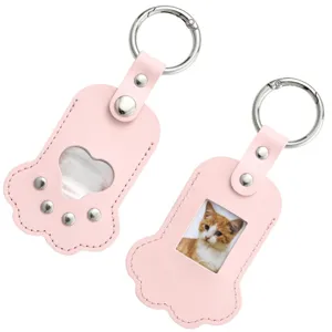 Cute pink paw shaped pet photo and hair keepsake leather keychain detail close up view