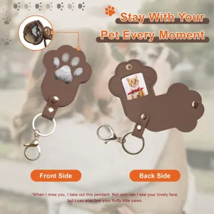 Cute paw shaped pet memorial keychain with photo slot and hair storage window brown leather.