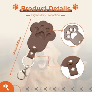 Detailed view of the brown PU leather pet paw photo memorial keychain with metal rings.