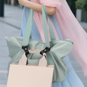 Detailed view of stylish travel tote bag set with comfortable straps and spacious storage capacity.